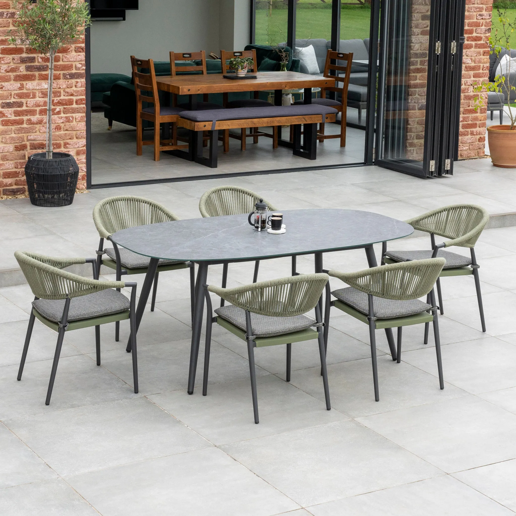 Cloverly 6 Seat Rope Oval Dining Set with Ceramic Table in Olive Green